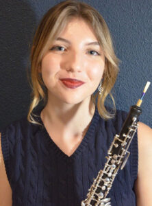 Cat Huss posing with her oboe