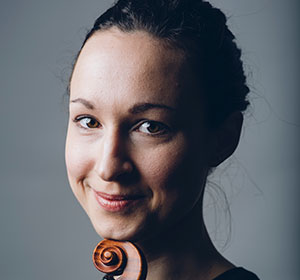 Taryn posing with a violin