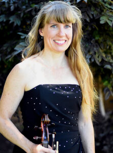 Leah Carl posing with her violin