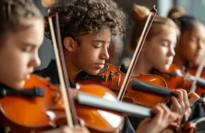 photo of young people playing violins