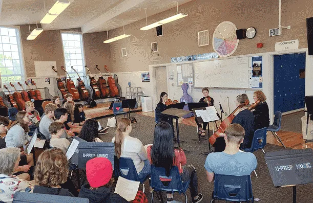 photo of string quartet in a classroom