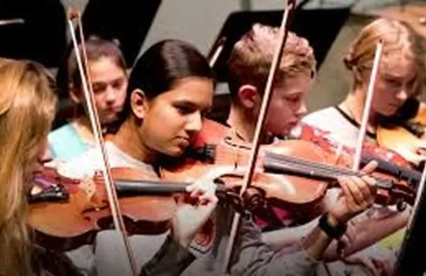 young people playing violins
